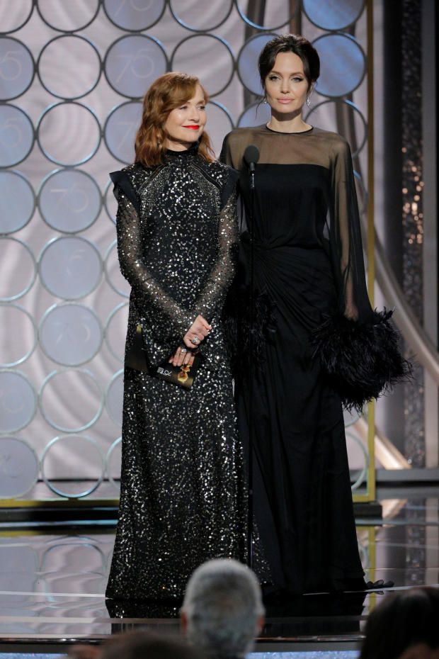 Presenters Isabelle Huppert and Angelina Jolie at the 75th Golden Globe Awards in Beverly Hills, California 