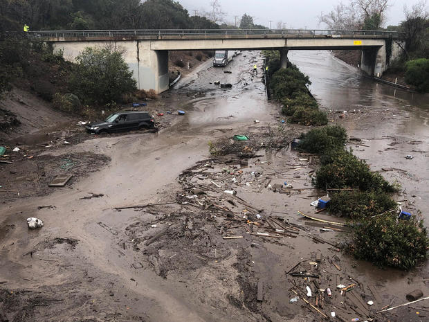 Abadoned cars stuck in flooded water on the freeway after a mudslide in Montecito 