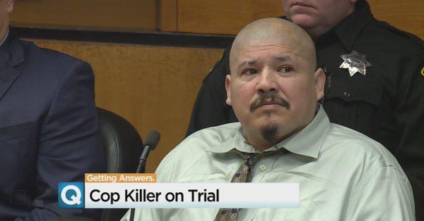 Copkilling suspect laughs in courtroom outburst, threatens to kill