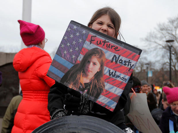 Eight year-old Charlotte Turchi holds a "Future Nasty Woman" sign during the local second annual Women's March in Cambridge 