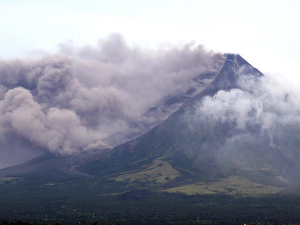 The Mayon volcano spews a column of ash during another mild eruption in Legazpi City, Albay province, south of Manila 