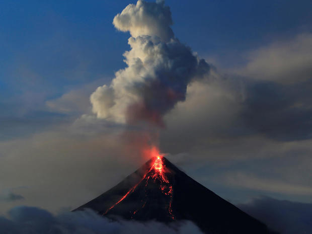 Lava flows from the crater of Mount Mayon volcano during a new eruption in Legazpi city 