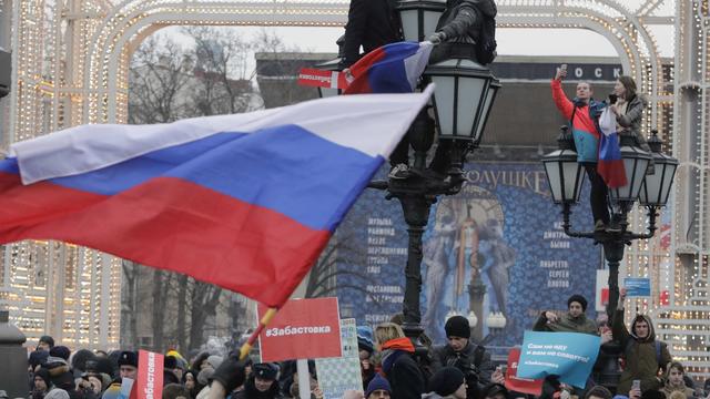 People gather in a square during a rally of supporters of Russian opposition leader Navalny in Moscow 