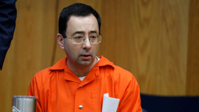 Larry Nassar, a former USA Gymnastics team doctor who pleaded guilty in November 2017 to sexual assault charges, sits in a courtroom as victims give statements during his second sentencing hearing in Eaton County Circuit Court in Charlotte, Michigan, on J 