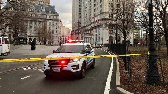 Crews work the scene after police say a man fatally shot himself in the head outside New York's City Hall on Feb. 5, 2018. 