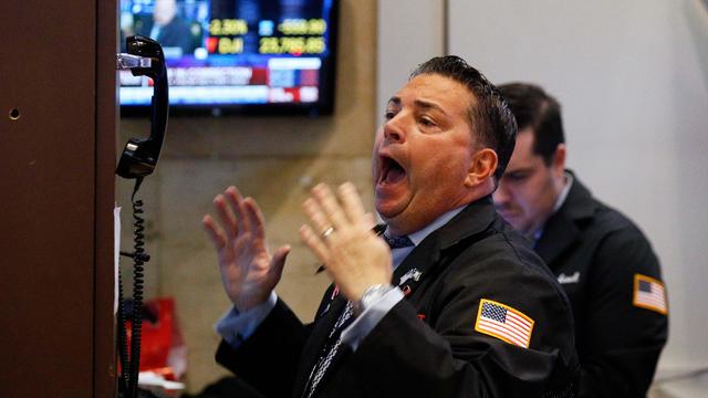 A trader reacts on the floor of the New York Stock Exchange in New York 