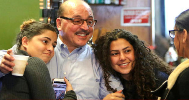 Businessman Amer Adi Othman, known as Al Adi, second from left, stands with his daughters in Youngstown, Ohio, Jan. 2, 2018. 
