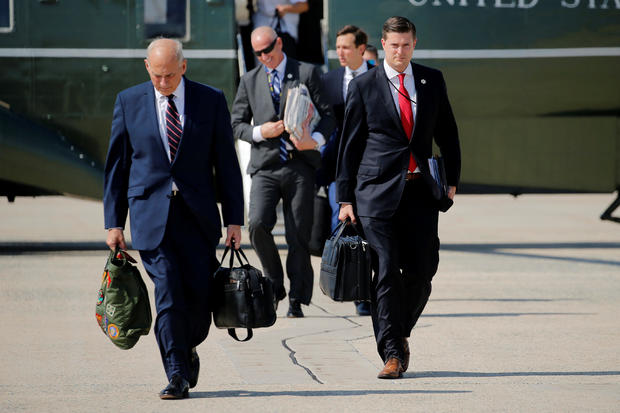 Porter and Kelly walk to board Air Force One with Trump at Joint Base Andrews, Maryland 