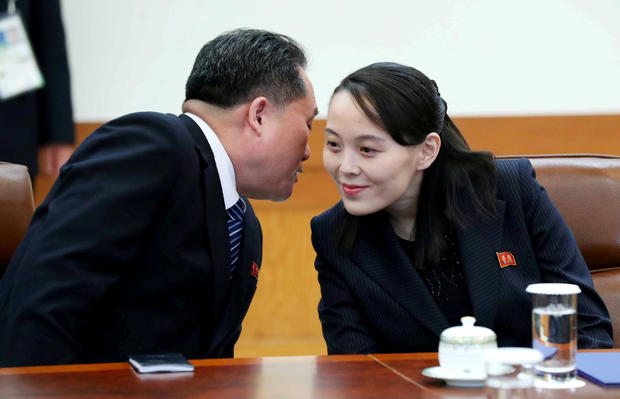 Ri Son-kwon, chairman of the Committee for the Peaceful Reunification of the Fatherland whispers to Kim Yo Jong, the sister of North Korea's leader Kim Jong Un before their meeting at the Presidential Blue House in Seoul 