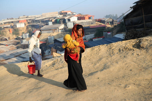 Rohingya refugees walk at Jamtoli camp in the morning in Cox's Bazar 