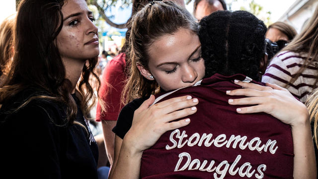 FILE PHOTO:    Students from Marjory Stoneman Douglas High School attend a memorial following a school shooting incident in Parkland 