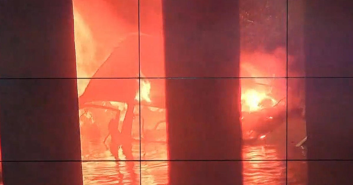 Driver fleeing police dies in fiery crash after car flies from bridge ...