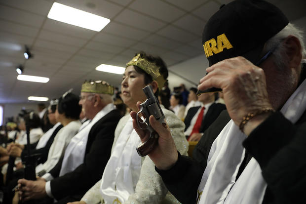 World Peace And Unification Sanctuary Religious Group Holds Blessing Ceremony For Couples And Their AR-15 Rifles 