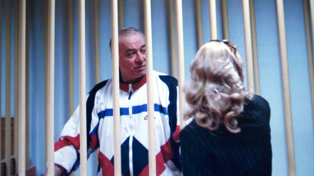 Sergei Skripal speaks to his lawyer from behind bars in this picture of a monitor outside a courtroom in Moscow, Russia, Aug. 9, 2006. 