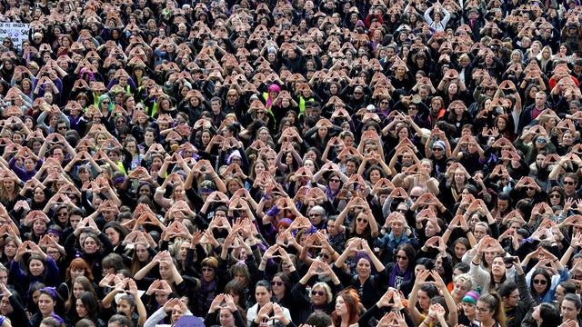 Protesters form triangles with their hands during a demonstration for women's rights in Bilbao 