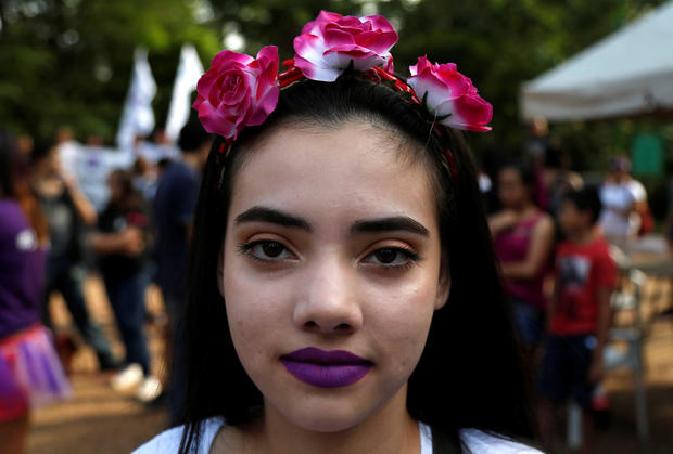 A woman participates in a demonstration as part of International Women's Day in Asuncion 