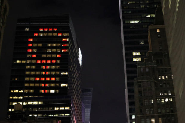 The female gender symbol is seen displayed on the Ernst and Young Building on International Women's Day in Times Square in New York City, New York 