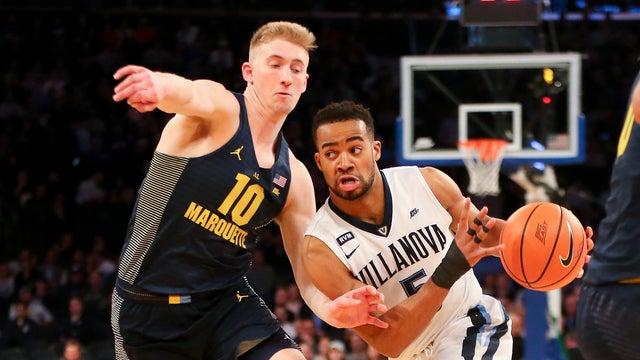 Villanova Wildcats guard Phil Booth (5) drives to the basket against Marquette Golden Eagles guard Sam Hauser (10) during the second half of the Big East Tournament quarterfinals at Madison Square Garden March 8, 2018, in New York. 