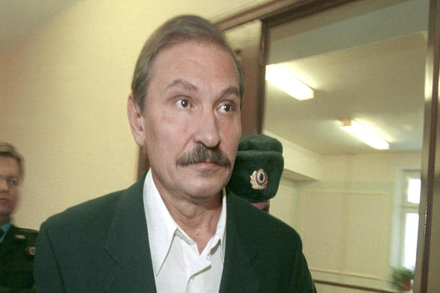 Nikolai Glushkov, ex-deputy director general of flagship Russian airline Aeroflot, leaves court escorted by police officers after a judge refused to release him on bail in Moscow Dec. 19, 2000. 