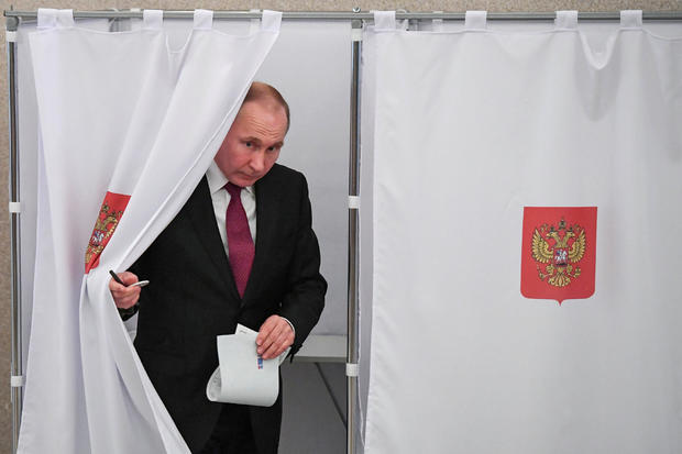 Russian President and Presidential candidate Vladimir Putin at a polling station during the presidential election in Moscow 