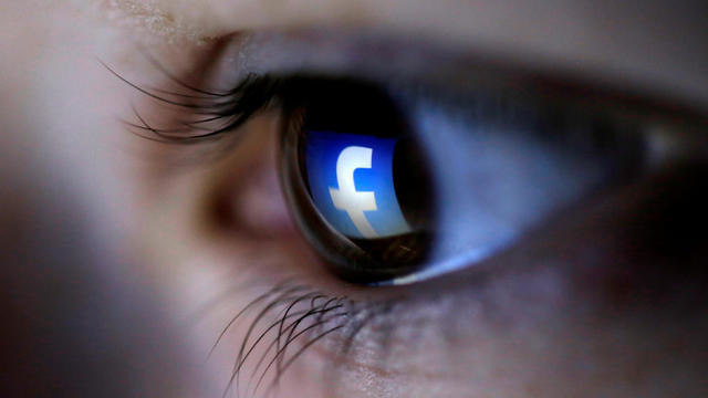 FILE PHOTO: A picture illustration shows a Facebook logo reflected in a person's eye, in Zenica 