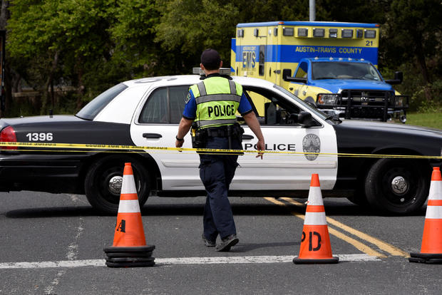 Members of the Austin Police Department block off part of Republic of Texas Boulevard following an explosion in Austin, Texas, March 19, 2018. 
