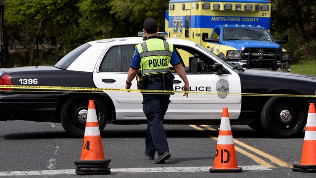Members of the Austin Police Department block off part of Republic of Texas Boulevard following an explosion in Austin, Texas, March 19, 2018. 
