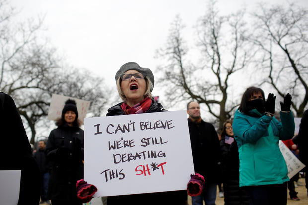 A woman holds a sign as she attends the "March for Our Lives" event after recent school shootings, at a rally in Chicago 
