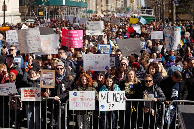 Protesters raise signs during a "March For Our Lives" demonstration demanding gun control in New York City 