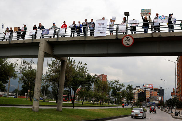 People take part in the "March for Our Lives", an organized demonstration to end gun violence in the United States, outside the U.S. embassy in Bogota 