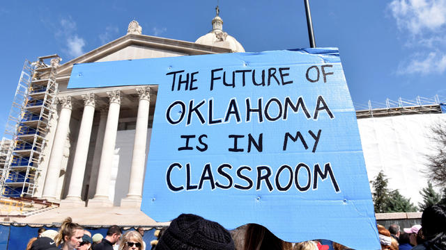 Teachers rally outside the state Capitol on the second day of a teacher walkout to demand higher pay and more funding for education in Oklahoma City 