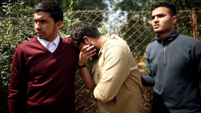 Colleagues of Palestinian journalist Yasser Murtaja, 31, who died of his wounds during clashes at the Israel-Gaza border on Friday, mourn during his funeral in Gaza city 