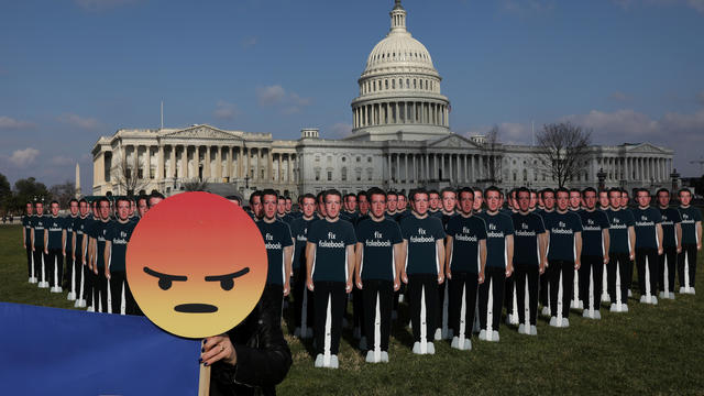 Protesters from Avaaz.org set up dozens of cardboard cut-outs of Facebook CEO Mark Zuckerberg outside of the U.S. Capitol Building in Washington 