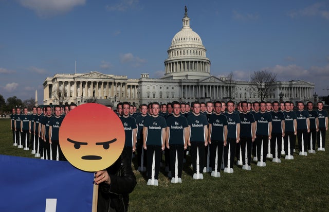 Protesters from Avaaz.org set up dozens of cardboard cut-outs of Facebook CEO Mark Zuckerberg outside of the U.S. Capitol Building in Washington 