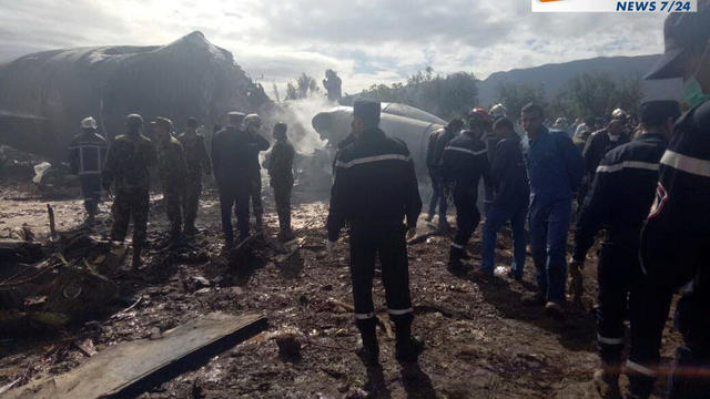 An Algerian military plane is seen after crashing near an airport outside the capital, Algiers, on April 11, 2018, in this still image taken from a video. 