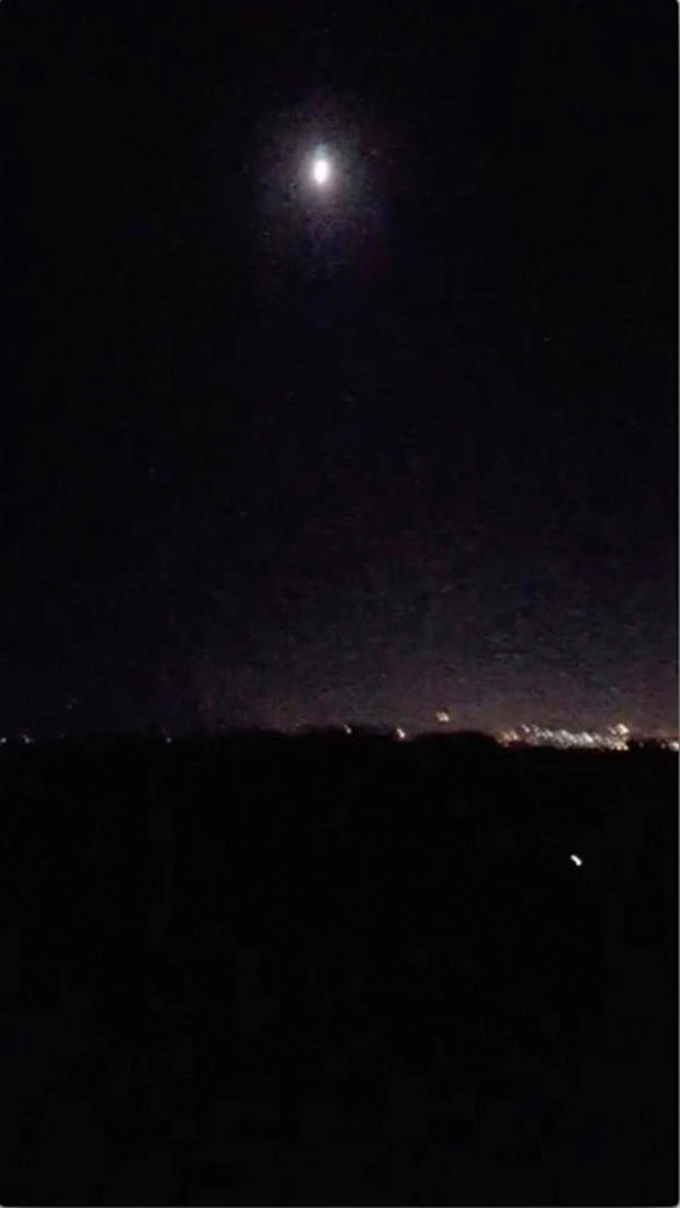 A missile descends onto Damascus, Syria, during an airstrike in this still image obtained from social media video 