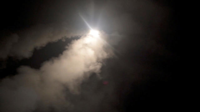 Smoke trails a missile as the U.S. Navy guided-missile cruiser USS Monterey fires Tomahawk land attack missiles 