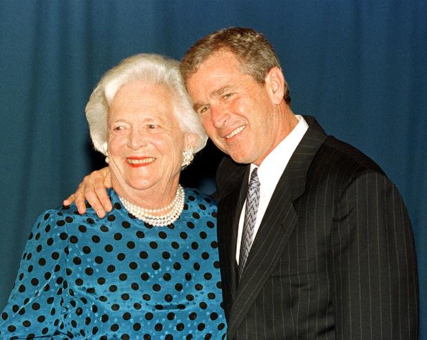 Texas Governor George W. Bush (R) hugs his mother 