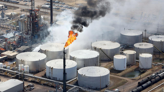 White smoke rises from the rupture in the tank just behind the smokestack following an explosion at Husky Energy oil refinery in Superior 