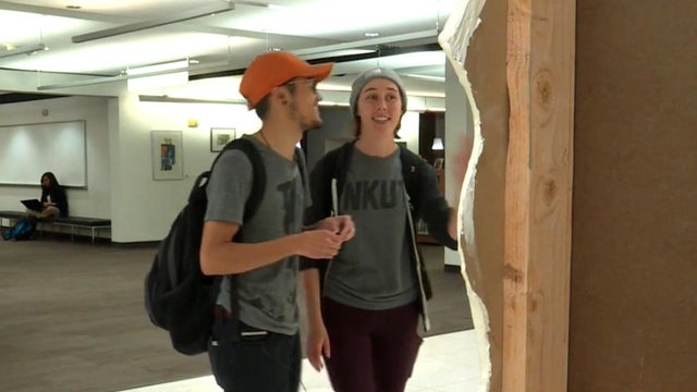 University of Utah students look at "The Cry Closet" at a library on campus. 