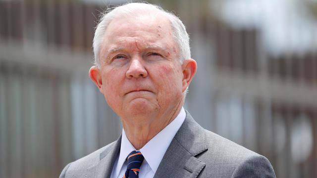 Sessions during news conference next to the U.S. Mexico border wall near San Diego 