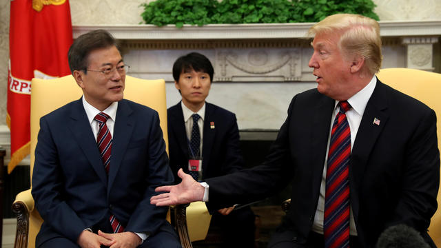 U.S. President Donald Trump welcomes South Korea's President Moon Jae-In in the Oval Office of the White House in Washington 