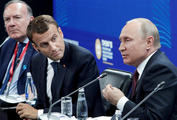 Russian President Putin and his French counterpart Macron attend a session of the St. Petersburg International Economic Forum 