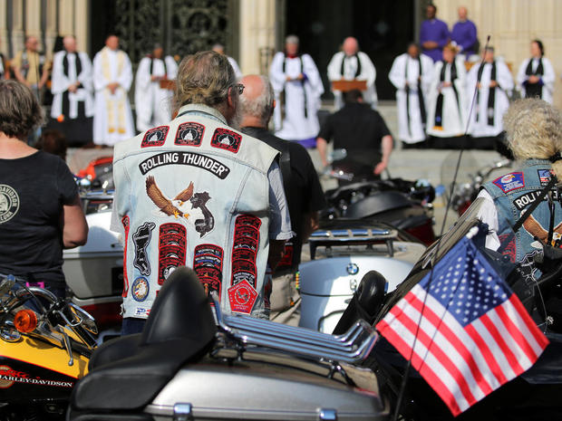 Rolling Thunder motorcyclists have their bikes blessed during a brief service at the National Cathedral in Washington 