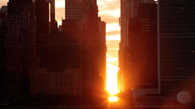 Sunset Alights Perfectly Between NYC Buildings During Manhattanhenge 