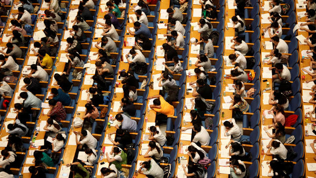 Students attend a lecture for the entrance exam for postgraduate studies at a hall in Jinan 