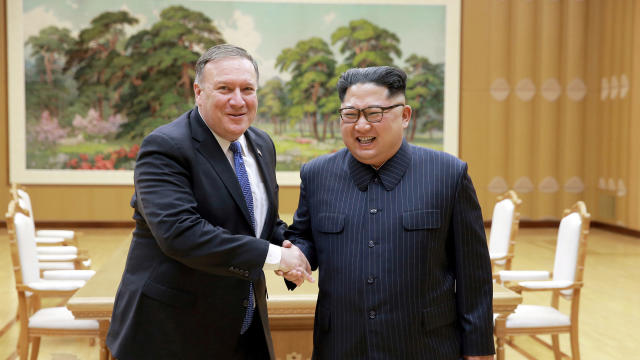 North Korean leader Kim Jong Un shakes hands with U.S. Secretary of State Mike Pompeo 