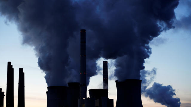 FILE PHOTO:  Steam rises from the cooling towers of the coal power plant of RWE in Neurath 