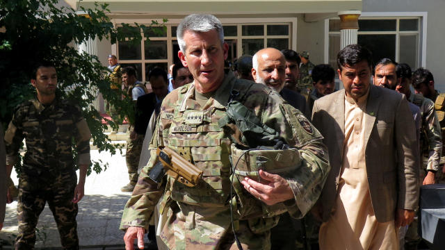 FILE PHOTO: U.S. Army General John Nicholson, commander of Resolute Support forces and U.S. forces in Afghanistan, walks with Afghan officials during an official visit in Farah province, Afghanistan 