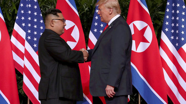 U.S. President Donald Trump shakes hands with North Korean leader Kim Jong Un at the Capella Hotel on Sentosa island in Singapore 